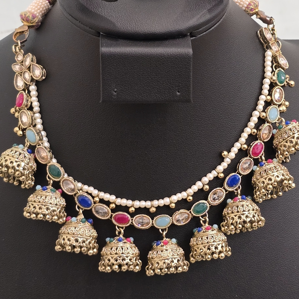 Ornate Gold and Red Necklace with Gemstones and Bell Pendants